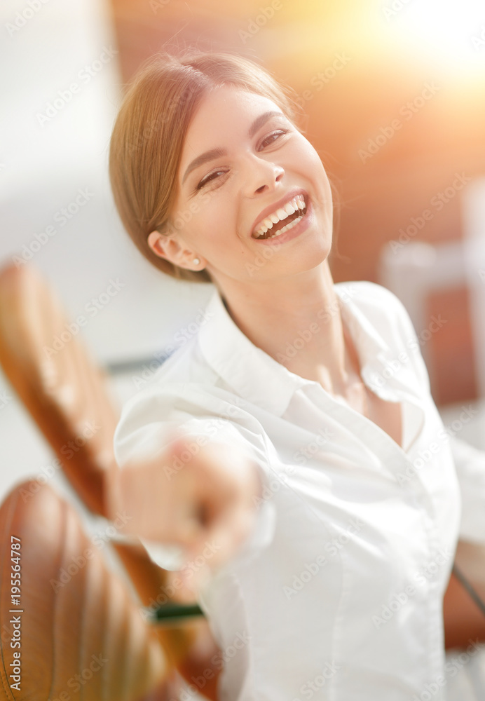 closeup portrait of young business woman at the workplace