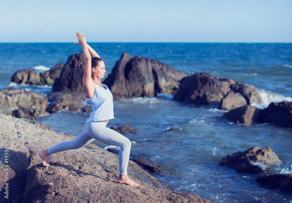 woman doing yoga on the beach woman doing yoga on the beach