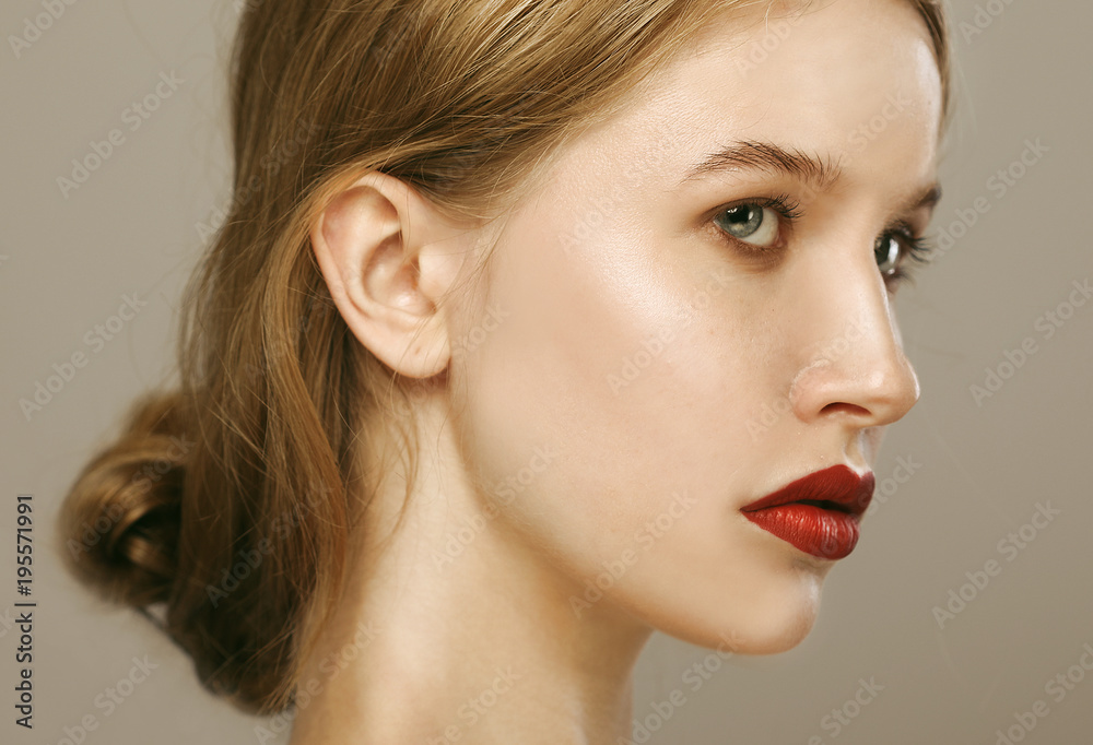 Beauty face of young woman, red lips make-up, clean skin. Beauty face of young woman, red lips make-up, clean skin.