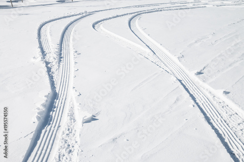 Car tire track in snow