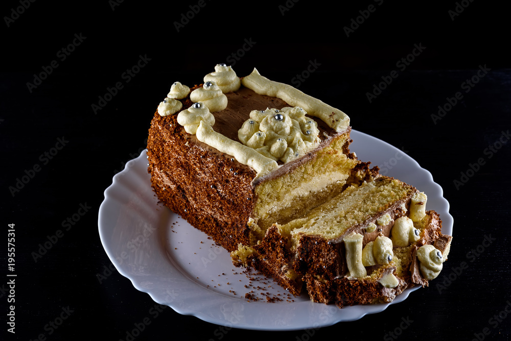 delicious home made biscuit cake on a black background delicious home made biscuit cake on a black background