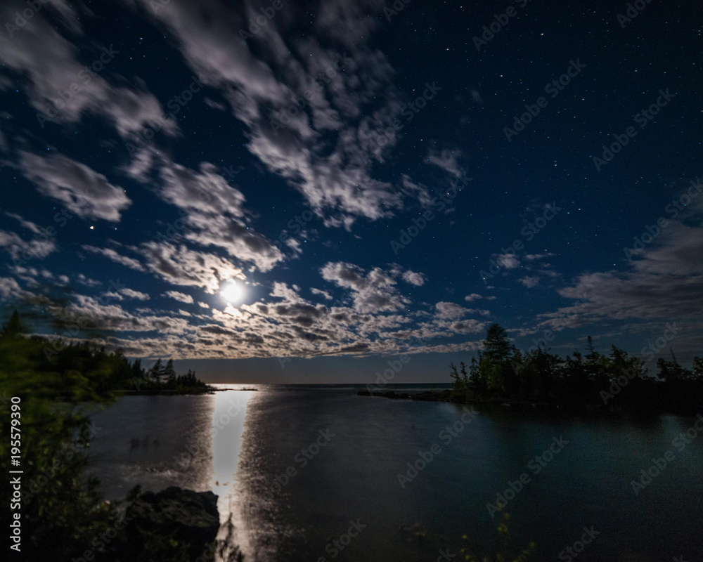Moonset over lake Huron at night