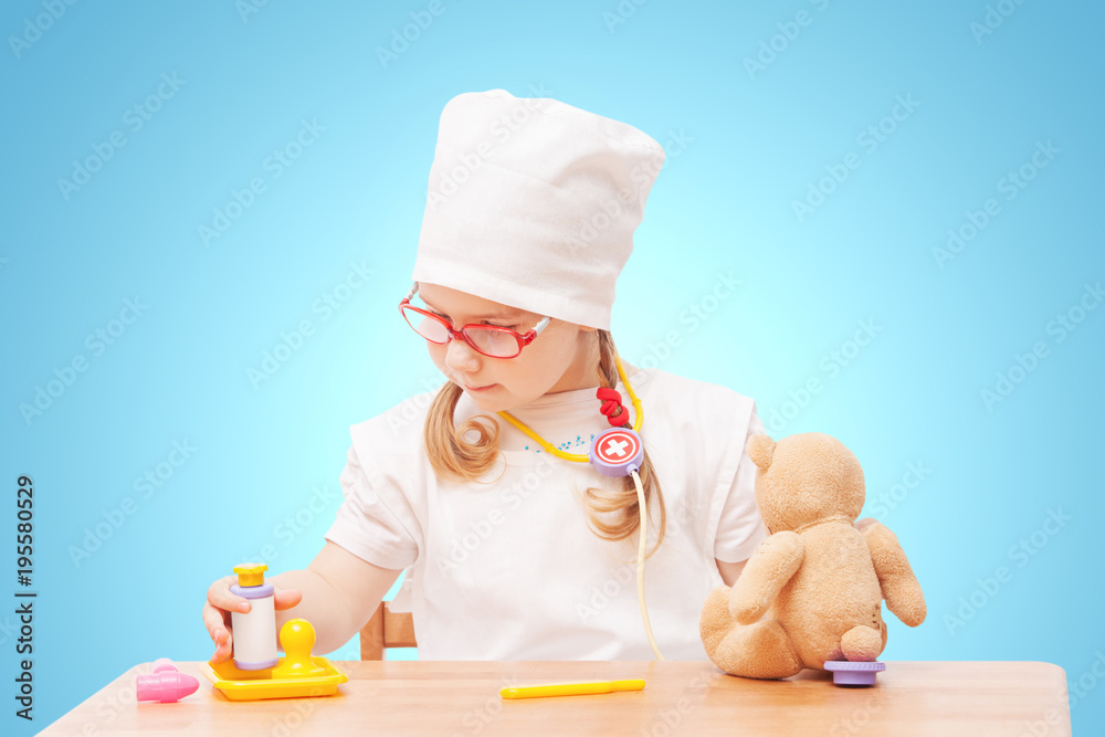 young girl with glasses plays in the doctor young girl with glasses plays in the doctor
