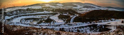 Fototapeta Naklejka Na Ścianę i Meble -  Panoramatic sunset over stone mine