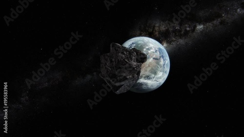 Asteroid approaching planet Earth. 3D animation.Texture courtesy of NASA. photo