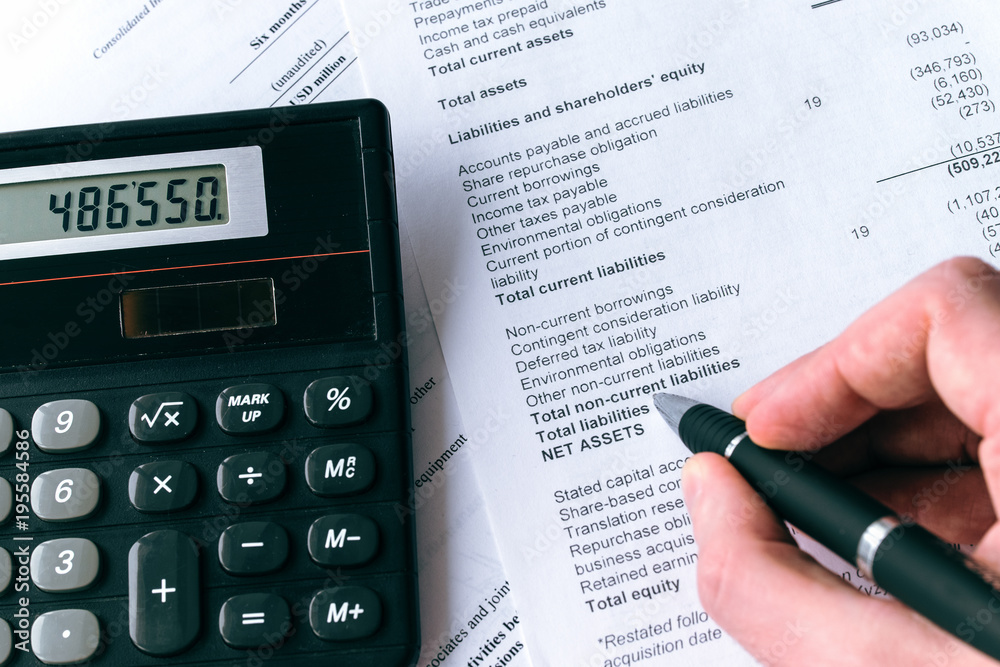 Close-up photo of a businessman analyzing financial data