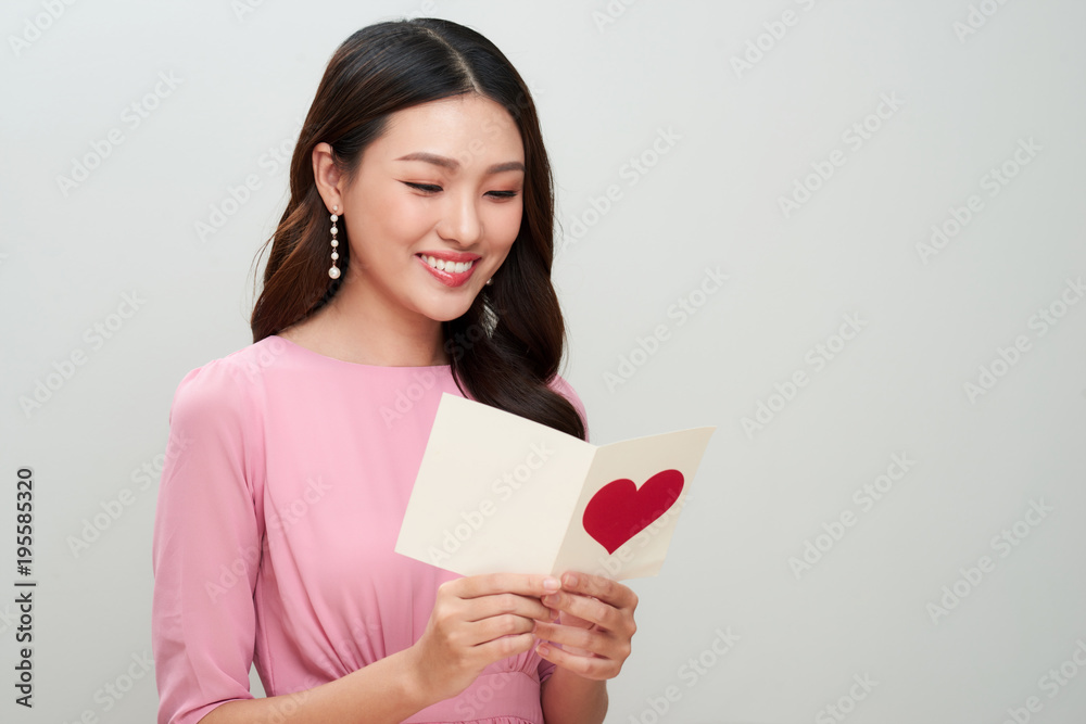 Beautiful asian girl reads love letter. Happy woman day. Beautiful asian girl reads love letter. Happy woman day.