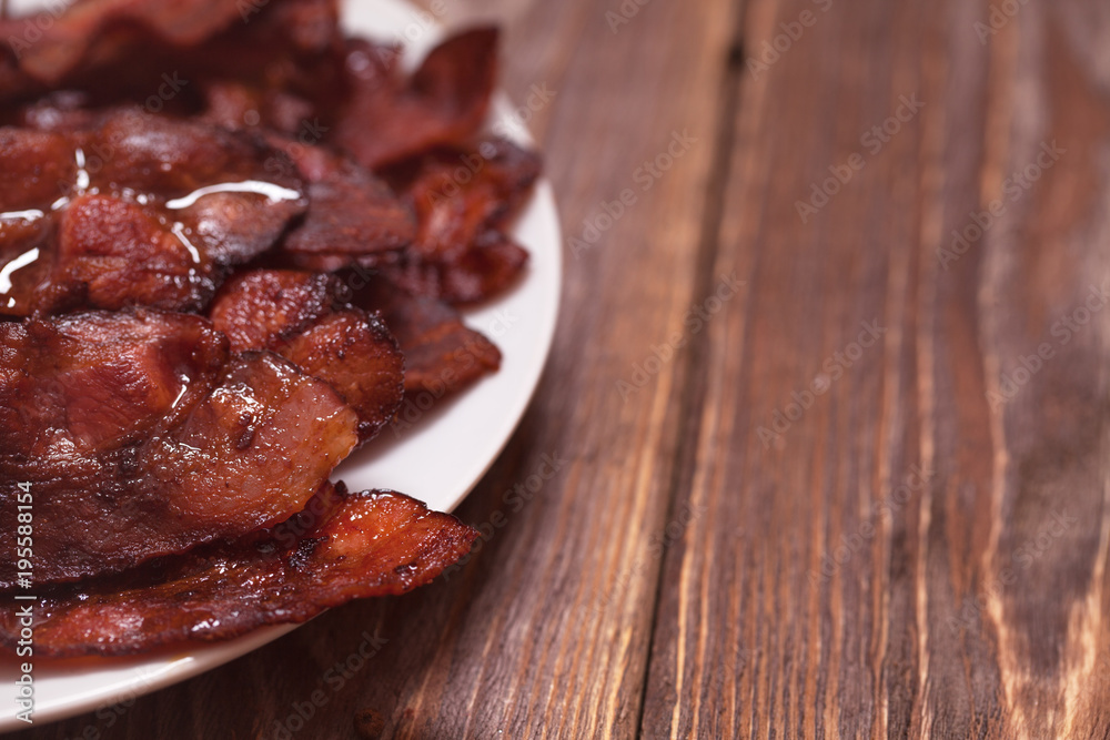 plate with fried bacon plate with fried bacon