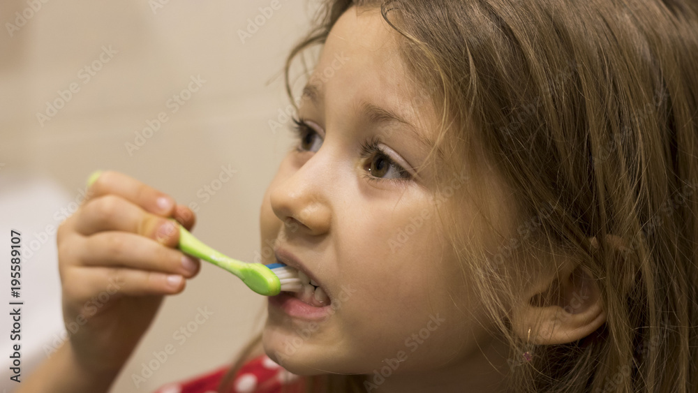 Cute little girl washing her teeth Cute little girl washing her teeth