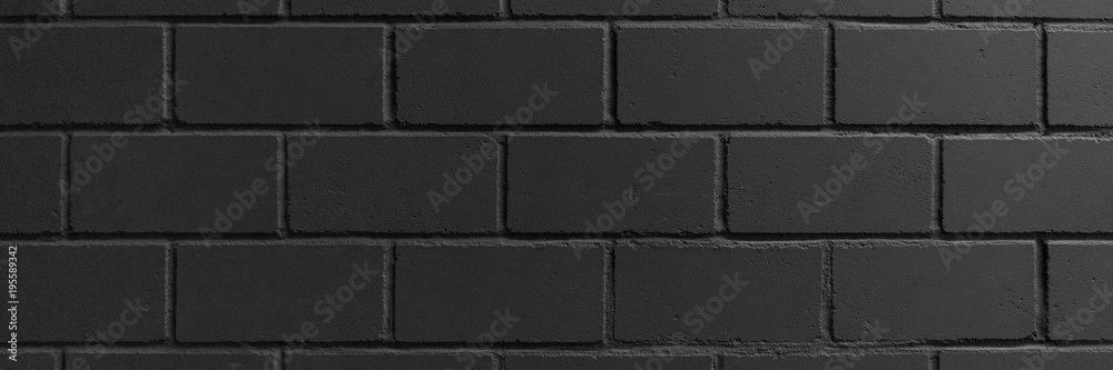 Naklejka premium Black painted brick wall for background, black texture