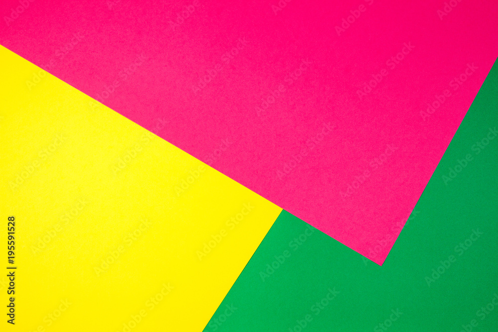 Color papers geometry flat composition background with yellow, green, and pink tones