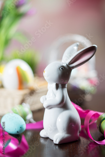 Happy easter. Easter eggs and easter decoration on the wooden table.