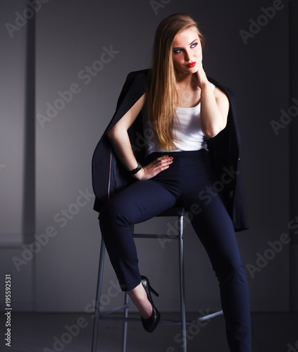 Young woman sitting on a chair . Young woman