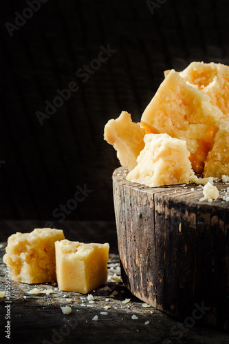 pieces of Parmesan cheese on wooden table