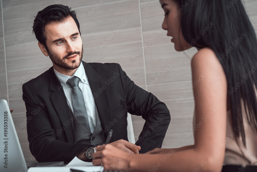 manager discussing work with his colleagues at meeting manager discussing work with his colleagues at meeting