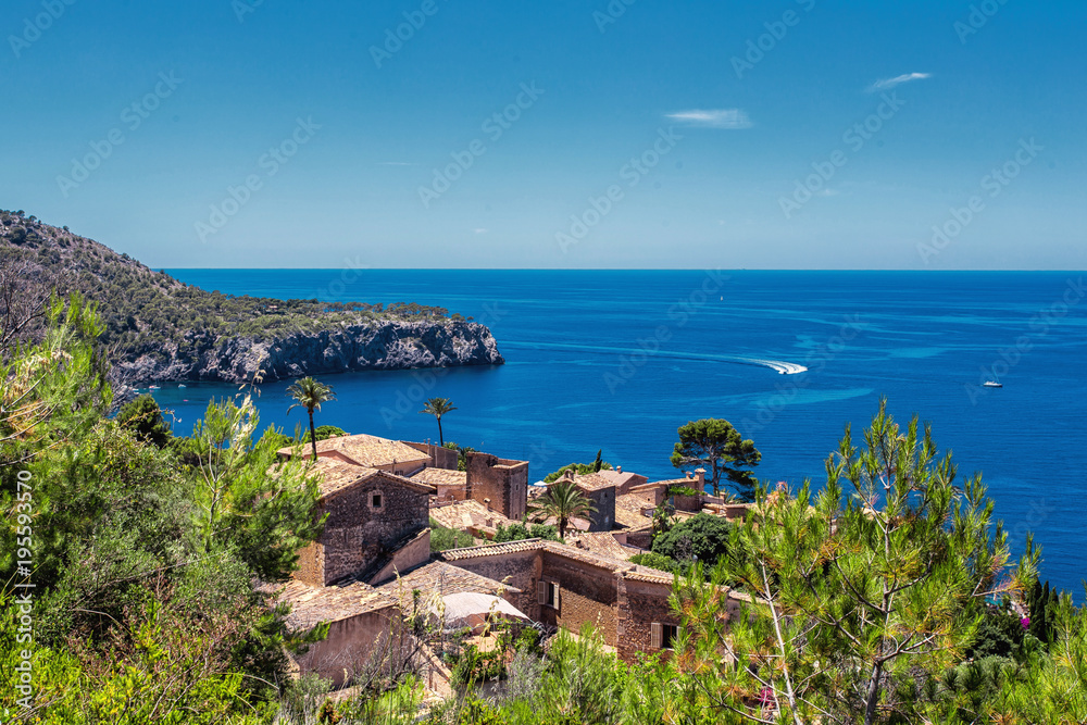 View of small village at the coastline of Deia, Mallorca Spain