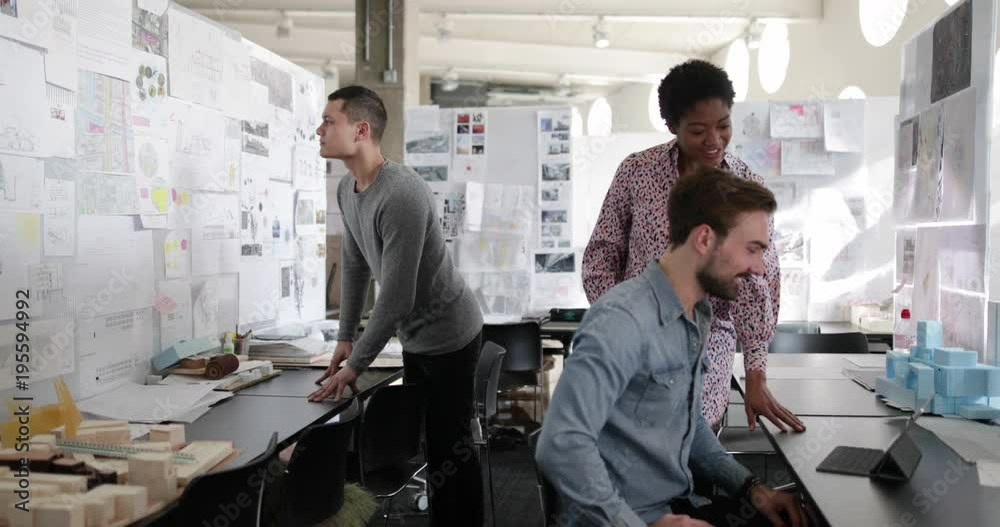 Designers working together in a creative office Designers working together in a creative office