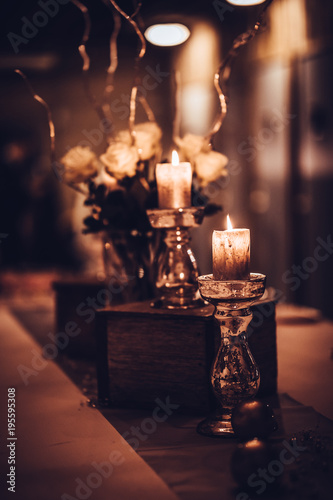 Candles on the table with flowers