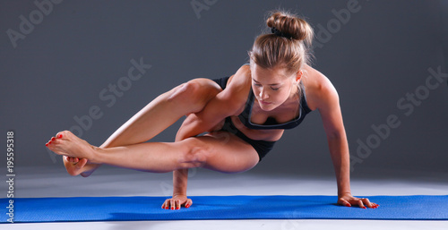 Portrait of sport girl doing yoga stretching exercise . yoga