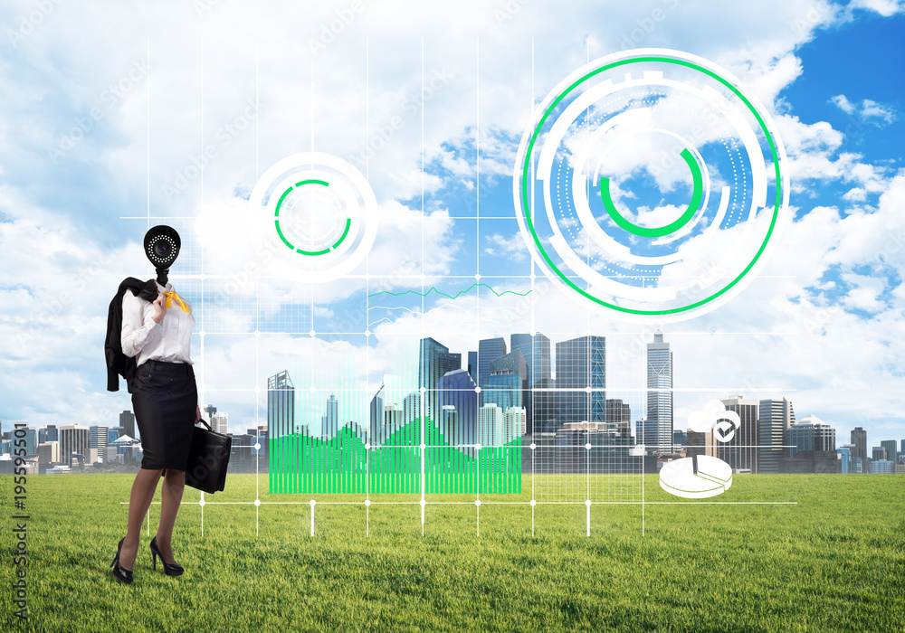 Camera headed woman standing on green grass against modern cityscape Camera headed woman standing on green grass against modern cityscape