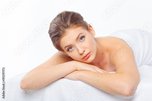 Young, beautiful and healthy woman in spa salon.