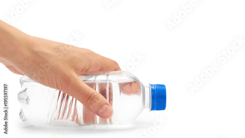 Fototapeta Naklejka Na Ścianę i Meble -  Female hand holds clean and fresh water packed in a plastic bottle. Isolated on white background. copy space, template