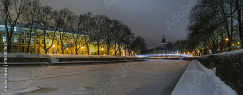 Turku by night. Urban landscape with frozen river.