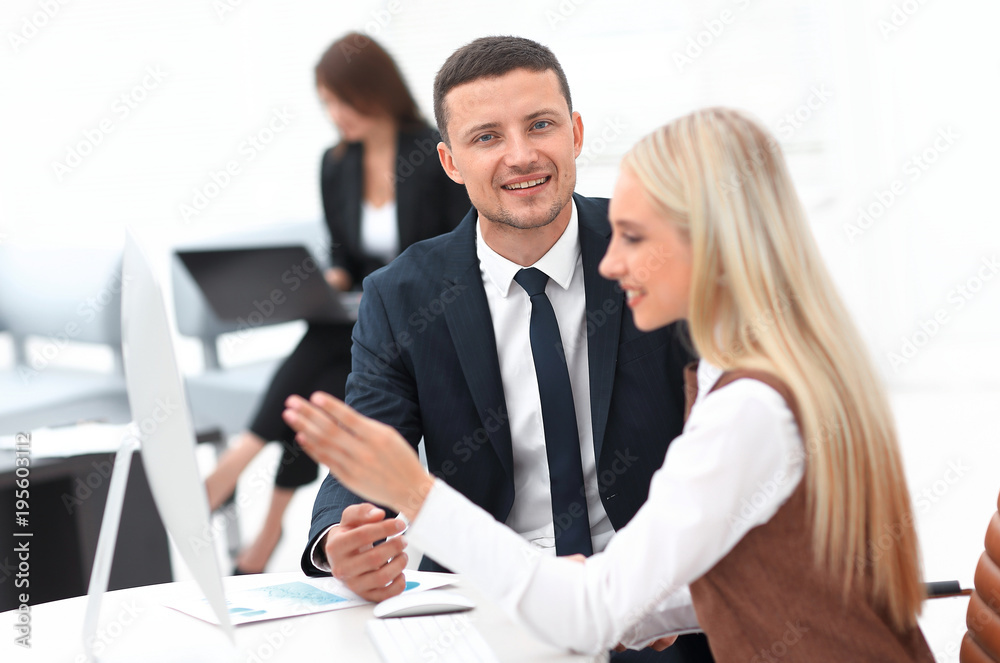 Manager talking with a colleague at the workplace Manager talking with a colleague at the workplace