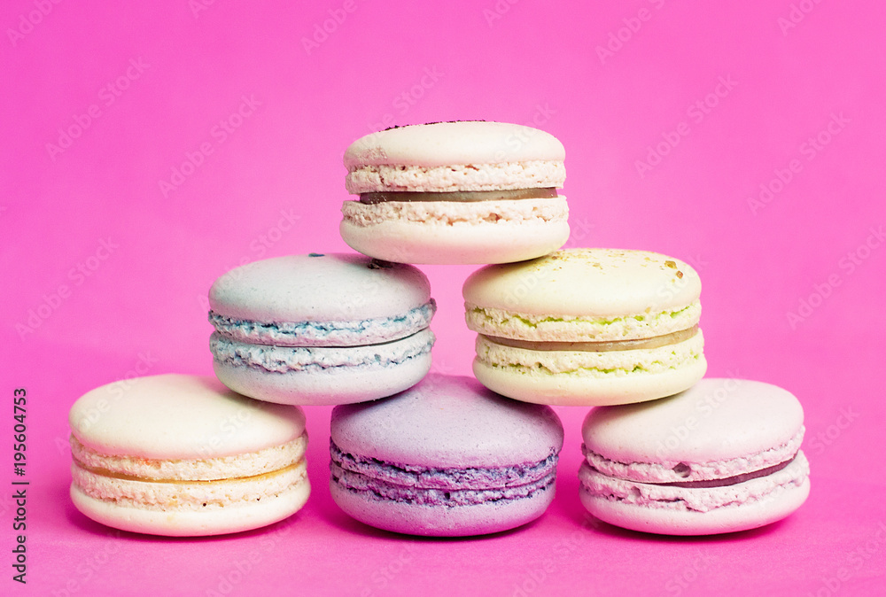 Fototapeta premium Colorful Macaroon in close up on pink background