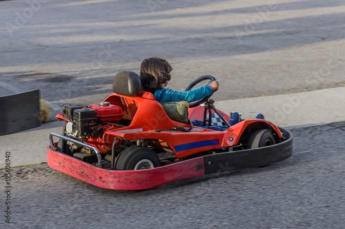 children go for a drive on karting