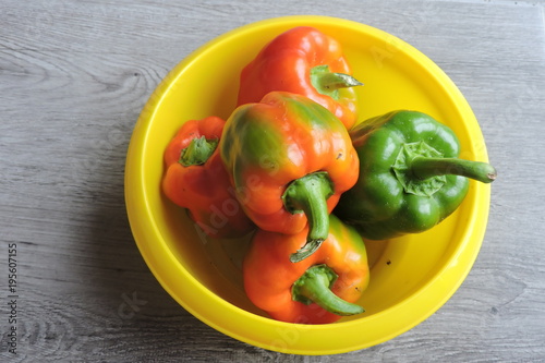 Orange, red and green peppers in a bowl