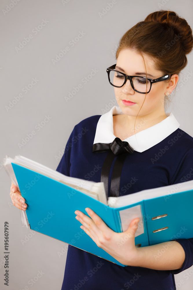 Focused business woman writing something down Focused business woman writing something down