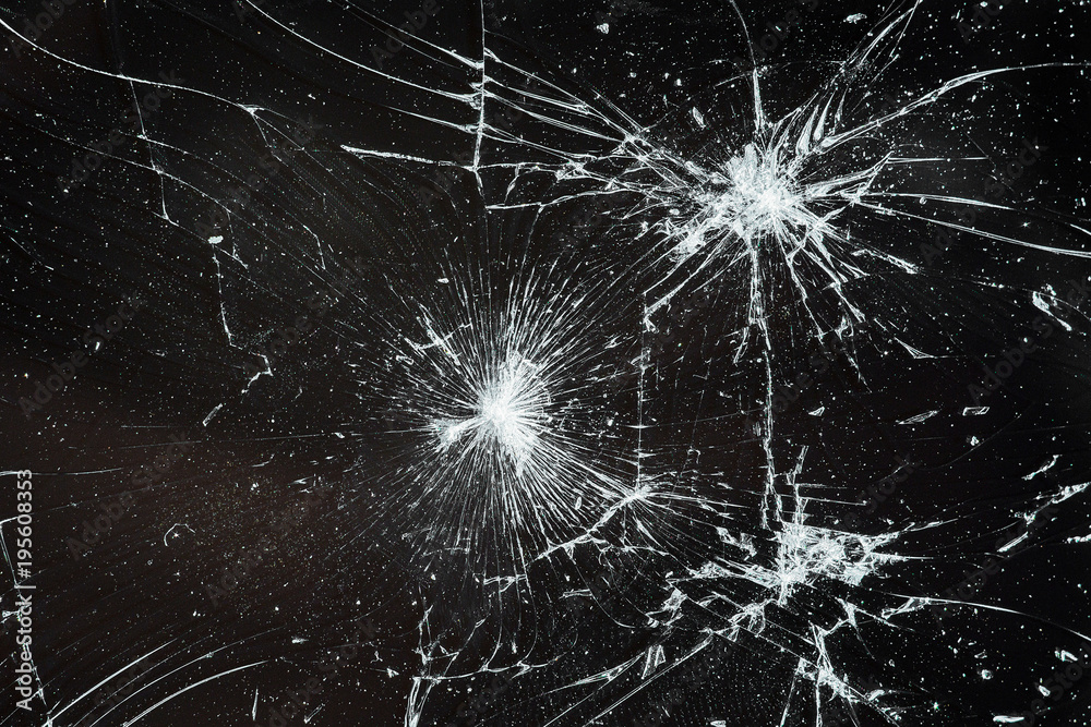 Obraz premium Cracked smart phone screen close-up. Broken glass texture background