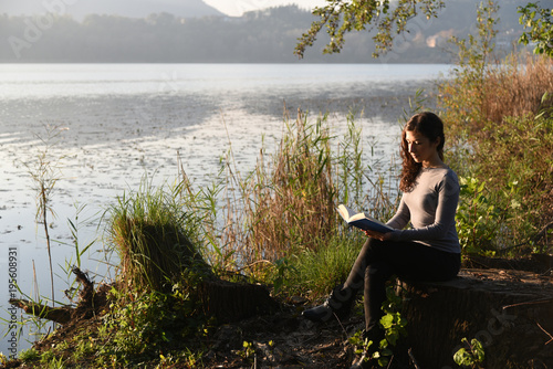 Beautiful girl reading a book