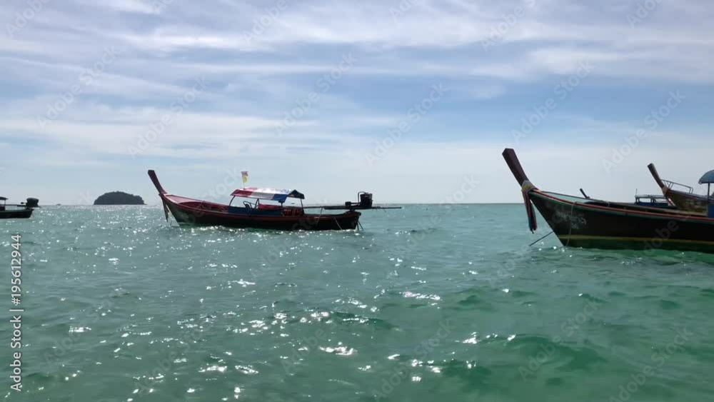 Seascape view of Traditional Thai boat anchored in the Andaman sea, Thailand. Seascape view of Traditional Thai boat anchored in the Andaman sea, Thailand.