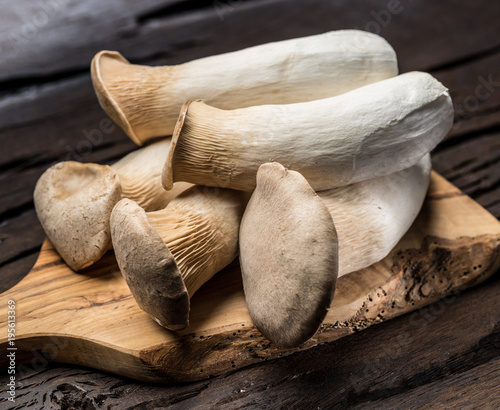 King oyster mushrooms on the wooden background. photo