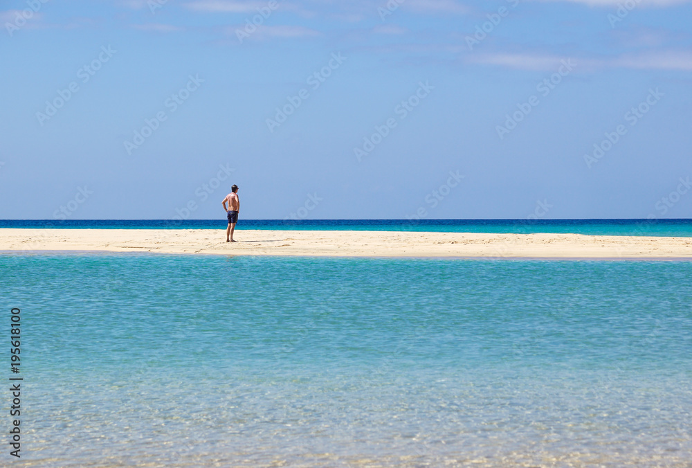 Freedom and happiness. Man rising hands up on the sea beach. Freedom and happiness. Man rising hands up on the sea beach.