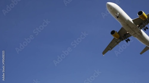 BARCELONA, SPAIN- JANUARY 20, 2018: Vueling Airlines plane arriving at El Prat Airport on schedule. Barcelona, Catalonia photo