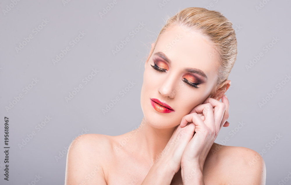 Model posing with eyes closed wearing professional make-up. Model posing with eyes closed wearing professional make-up.