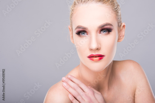 Portrait of sexy young blonde woman wearing make-up.
