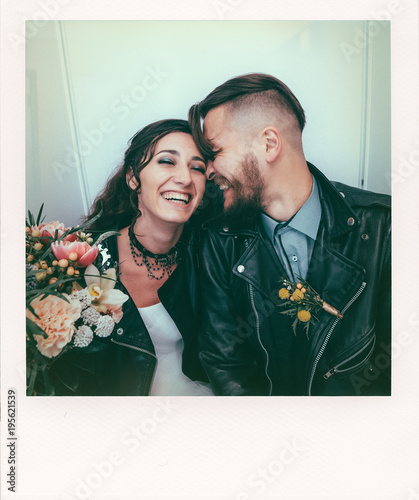 Wedding in the style of rock. Rocker or Biker wedding. Guys with stylish leather jackets. It's a rock'n'roll baby. The sweet couple are photographed in a photobooth.