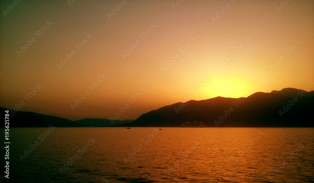 amazing sunset, sea and mountains