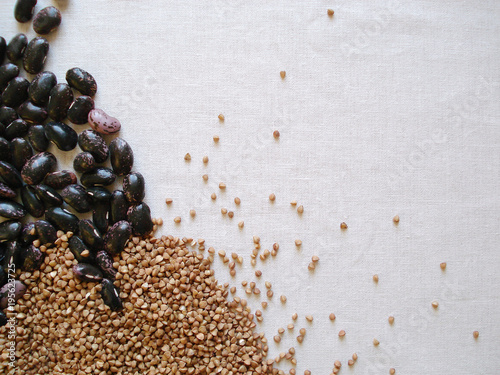 Pulses and grains in the assortment. Mix of whole, organic cereals. Beans and buckwheat are a top view. Empty place for text. photo