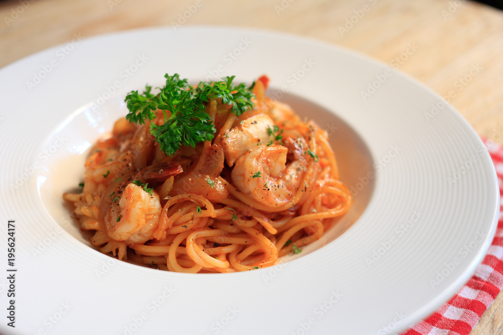 Top view SpaghettiMarinara on wooden background. Top view SpaghettiMarinara on wooden background.