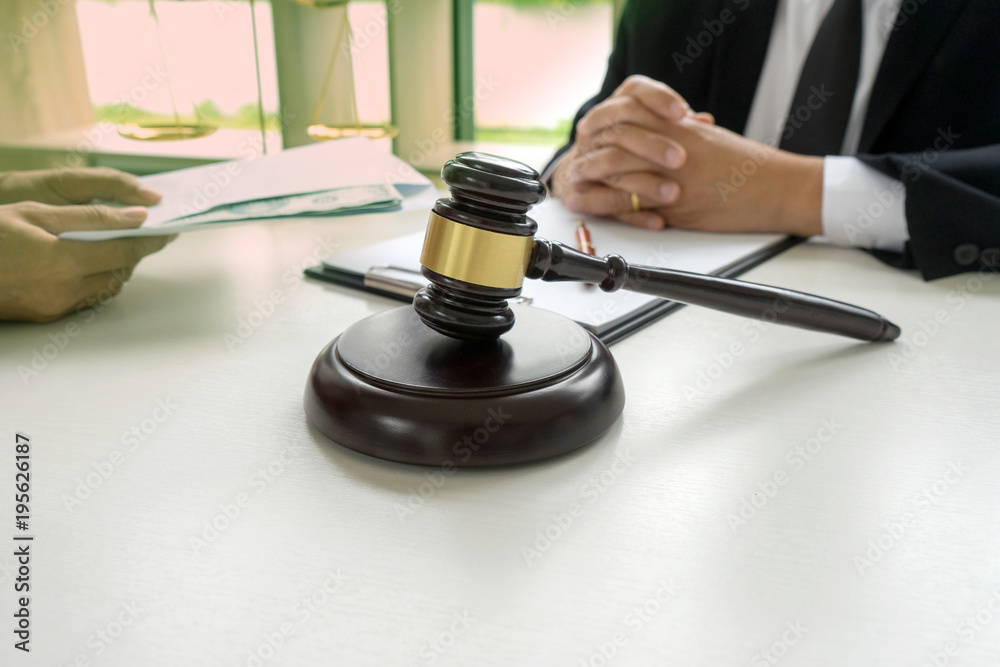 Judge lawyer gavel with bribe money in law firm Judge lawyer gavel with bribe money in law firm