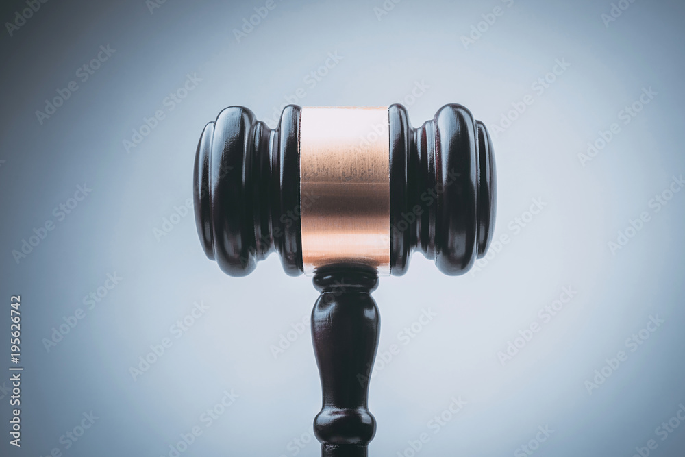 Black Judge Wood Hammer with blue background Black Judge Wood Hammer with blue background