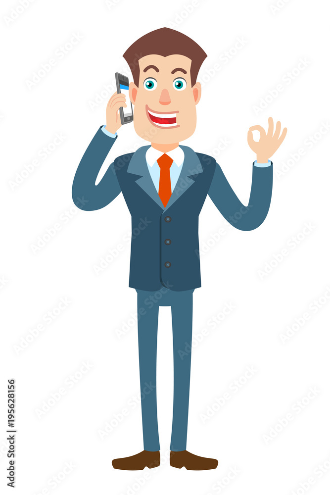 Businessman talking on mobile phone and showing a okay hand sign Businessman talking on mobile phone and showing a okay hand sign