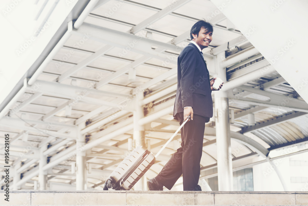 Fototapeta premium Businessman walking in a city. Business concept.