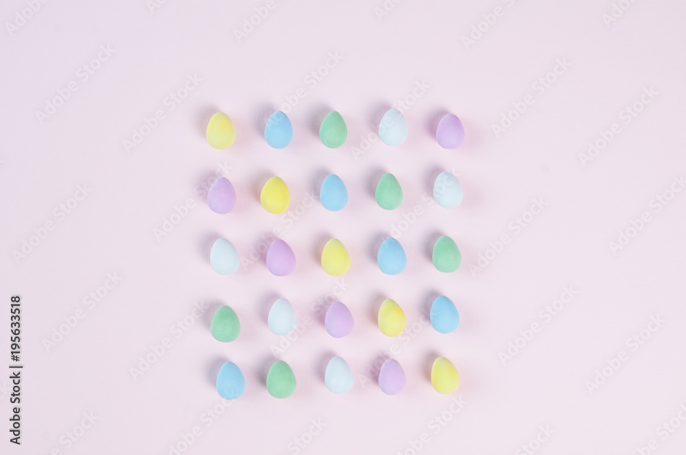 pastel easter eggs on a pink background