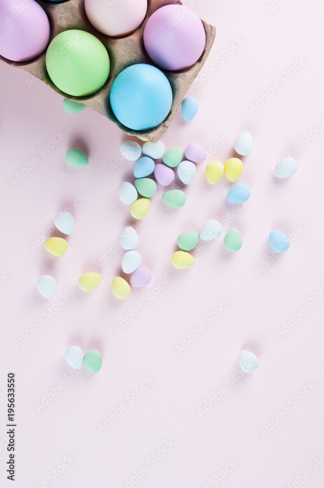 pastel colored easter eggs on a pale pink background pastel colored easter eggs on a pale pink background